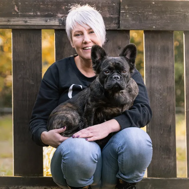Els holding a brindle French Bulldog